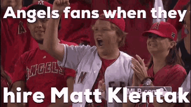 angels fans when they hire matt klentak are cheering in the stands at a baseball game