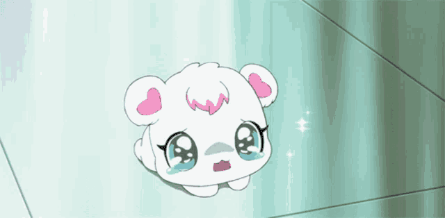 a white teddy bear with pink hearts on its ears