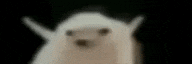 a blurry picture of a stuffed animal with a black background