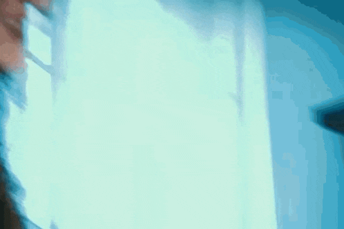 a close up of a person 's face with a blue background .