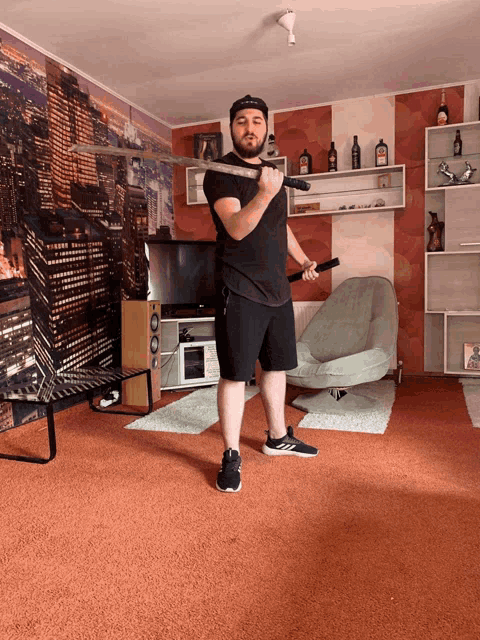 a man holds a sword in a living room