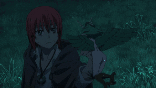 a person is holding a fairy in their hand in a forest