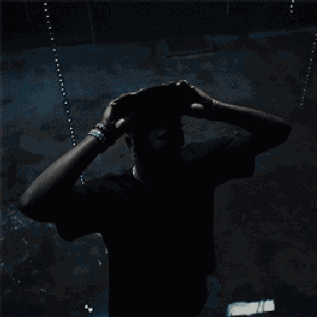 a man wearing a baseball cap with the word kanye on it