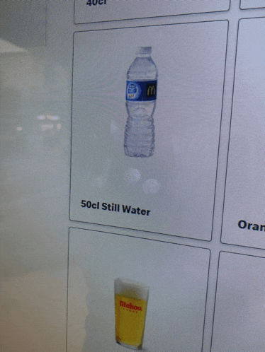 a screen shows a bottle of still water and a glass of beer