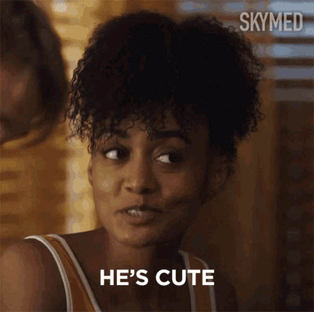 a woman with curly hair says he 's cute in a skymed ad