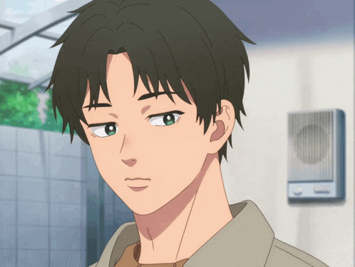 a close up of a young man 's face with a serious look on his face