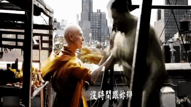 a man in a yellow jacket is standing next to a man in a green suit with chinese writing on it