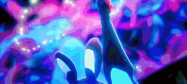 a person 's hand is reaching out towards a purple and blue background .