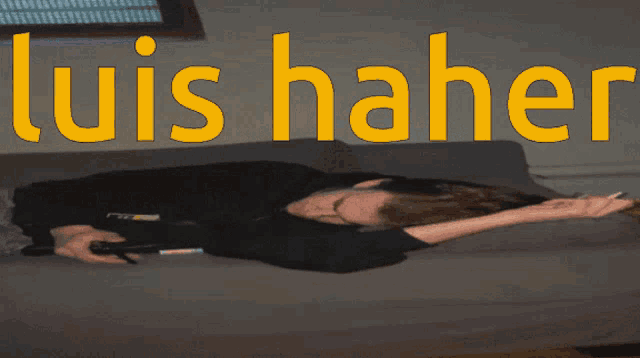 a person laying on a couch with the name luis haber written in yellow