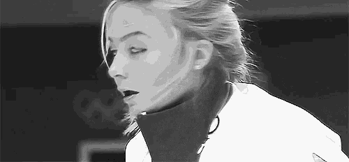 a black and white photo of a woman wearing a turtleneck .