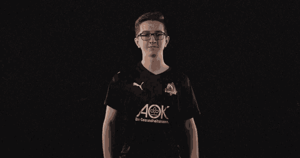 a young man wears a black shirt that says aok