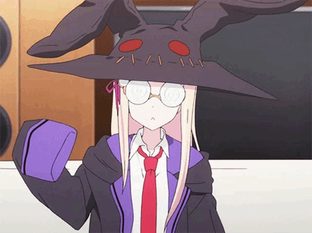 a girl with long blonde hair wearing a purple jacket and a red tie