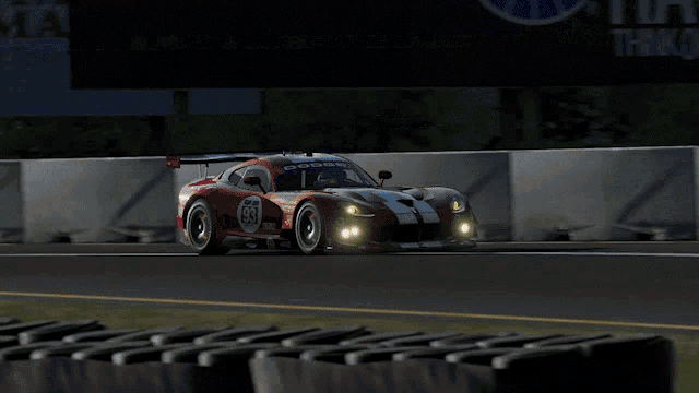 a red race car with the number 83 on it