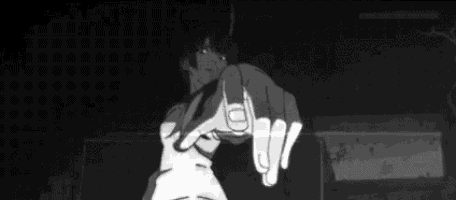 a black and white photo of a girl pointing at the camera with her finger .
