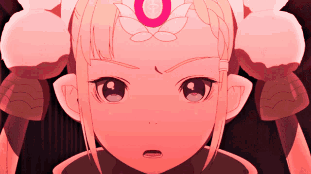 a close up of a girl 's face with a crescent moon on her forehead