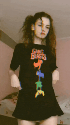 a girl wearing a black shirt that says gang beasts on it