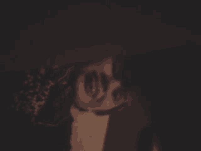 a blurred image of a person 's face with the word love on it