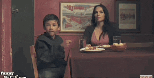 a boy holding a wand says expelliarmus while a woman watches
