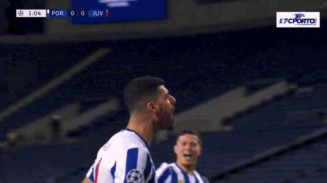 a soccer player in a blue and white uniform with the number 99 on his back