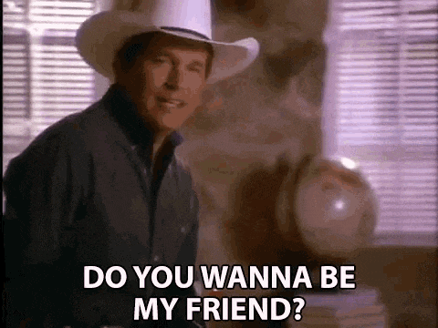 a man in a cowboy hat is standing in front of a window and saying `` do you wanna be my friend '' .