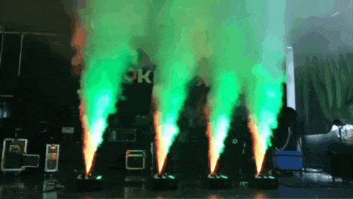 green smoke coming out of a machine with the word ok in the background