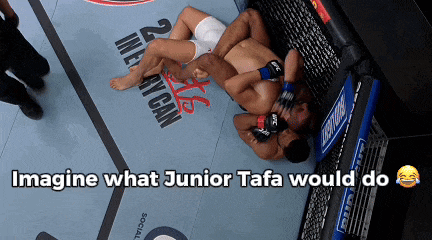 two men wrestling on a mat with the words imagine what junior tafa would do below them