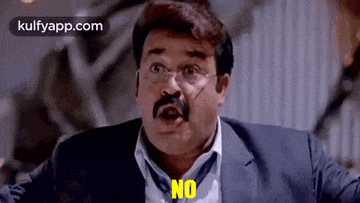 a man with glasses and a mustache is making a funny face and says no .