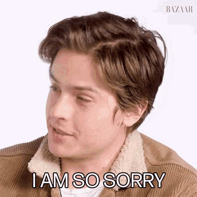 a young man says i am so sorry while wearing a brown jacket