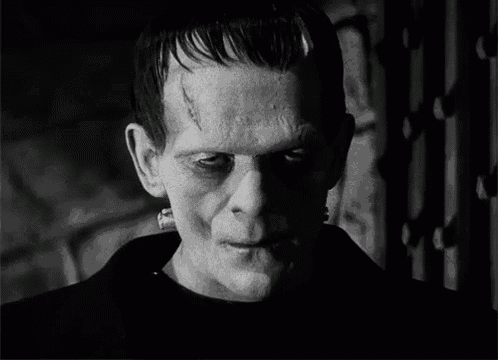 a black and white photo of a man with a very scary look on his face