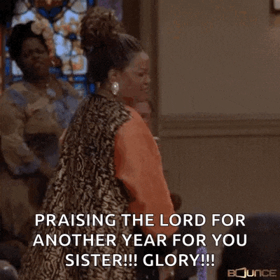 a woman in a church is praising the lord for another year for her sister .