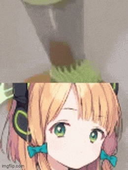 a close up of a girl 's face next to a blender and a cup .