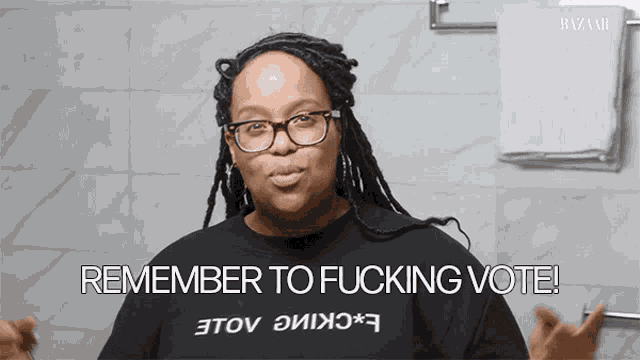 a woman wearing glasses and a black shirt says remember to fucking vote