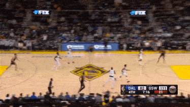 a basketball game is being played between the golden state warriors and the dallas cowboys