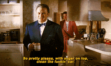a man in a tuxedo is holding a cup of coffee and saying so pretty please