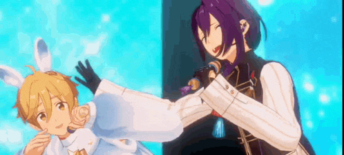a couple of anime characters are standing next to each other on a stage and one of them is holding a microphone .