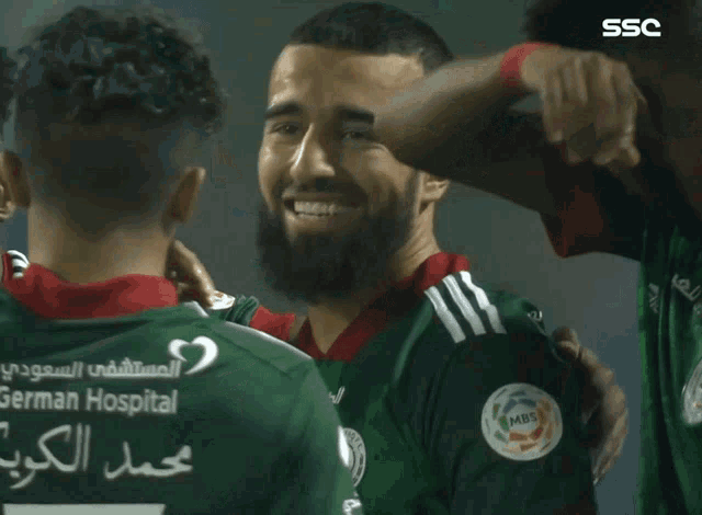 soccer player wearing a green jersey that says saudi germain on it