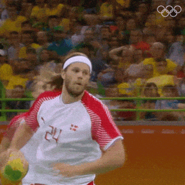 a man wearing a white and red jersey with the number 24 on it