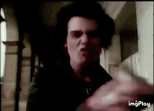 a gif of a man making a funny face with the words imgplay below