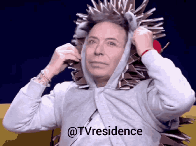 a man is wearing a hedgehog costume with the words @tvresidence written below him
