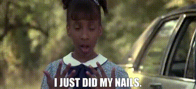 a girl is standing in front of a car and says i just did my nails