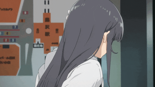 a girl with long black hair is standing in front of a map with chinese characters