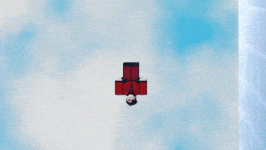 a person in a red shirt is flying through the air in a video game .