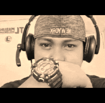 a man wearing headphones and a hat that says xroywem