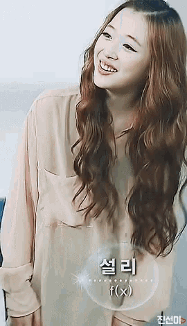 a woman with long hair is smiling in front of a bubble that says f ( x ) on it