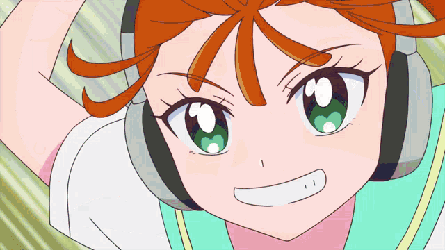 a girl with orange hair and green eyes is wearing headphones and smiling