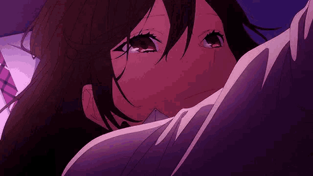 a close up of a person 's face with a purple background and a girl crying .