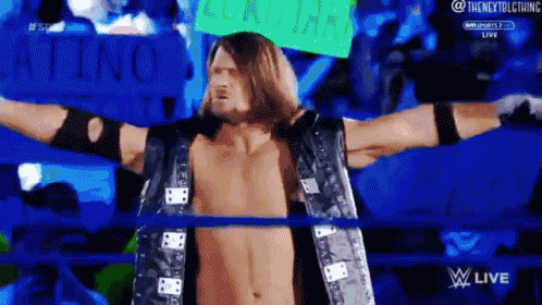 a man in a wrestling ring with a sign that says latino