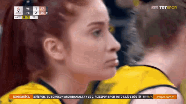 a tv screen shows a volleyball game between fb and ahty