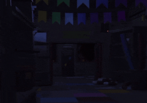a light is shining in the dark in a room with flags .