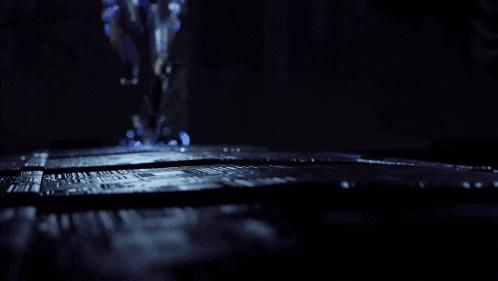 a close up of a person 's legs with blue lights coming out of them